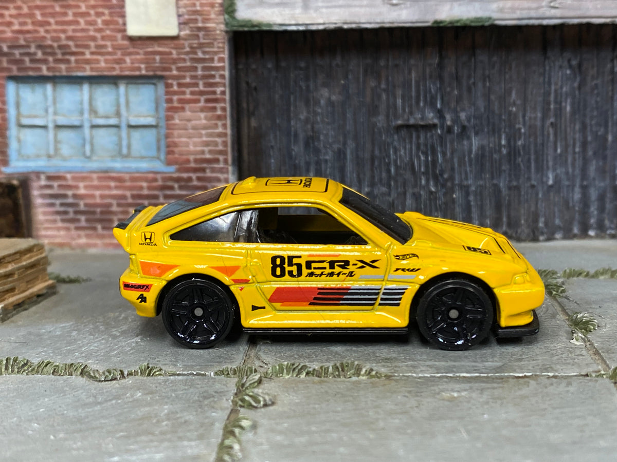 2026 Hot Wheels 1985 Honda CR-X yellow JJJ51 loose car, right-side view