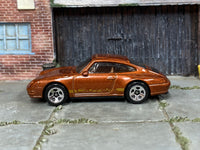 2026 Hot Wheels '96 Porsche Carrera metalflake root beer JJJ59 loose car, left-side view