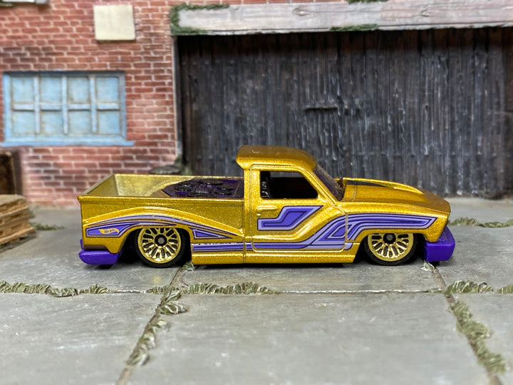 Hot Wheels 2026 Bounce'n Bass gold right-side view