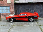 Hot Wheels 2026 Rivited red HW Torque left-side view