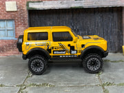 Hot Wheels '21 Ford Bronco metallic yellow number 2, right side view