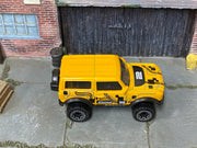 Hot Wheels '21 Ford Bronco metallic yellow number 2, top view