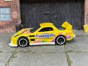 Hot Wheels 24/Seven yellow International Friendship Day, left side view