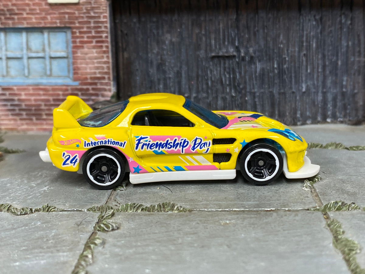 Hot Wheels 24/Seven yellow International Friendship Day, right side view
