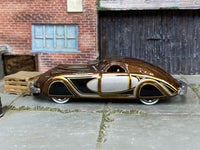 Hot Wheels '38 Phantom Corsair metallic brown, silver and gold loose car, left side view