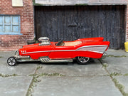 Hot Wheels '57 Roadster red and silver with five-spoke front wheels, left side view