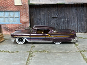 Hot Wheels '58 Impala dark purple with white scallops and whitewall wheels, left side view