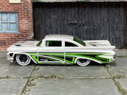 Hot Wheels '59 Chevy Impala white with green and black graphics, left side view