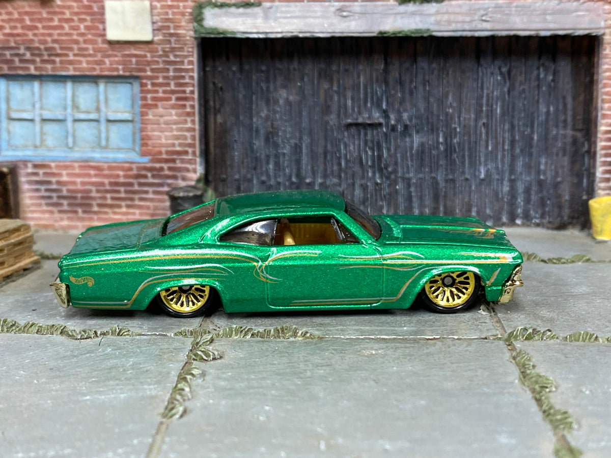 Hot Wheels '65 Chevy Impala green pinstripe loose car, right-side view