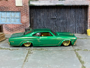 Hot Wheels '65 Chevy Impala green pinstripe loose car, right-side view