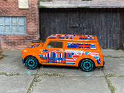 Hot Wheels ’67 Austin Mini Van orange Union Jack loose van, left side view