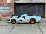 Hot Wheels 1967 Ford GT40 Mk.IV Gulf light blue number 9 loose car, left-side view