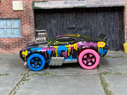 Hot Wheels 69 Camaro Z28 Tooned black paint-splatter loose car, left side view