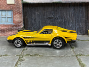 Hot Wheels ’69 Corvette yellow with black stripes and 427 graphics — left side view