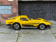 Hot Wheels ’69 Corvette yellow with black stripes and 427 graphics — right side view