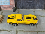 Hot Wheels ’69 Corvette yellow with black stripes and 427 graphics — top view