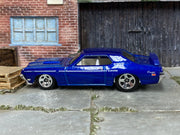 Hot Wheels ’69 Mercury Cougar Eliminator in blue with white stripes — left side view