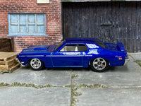 Hot Wheels ’69 Mercury Cougar Eliminator in blue with white stripes — left side view