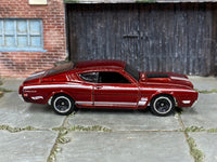 Hot Wheels '69 Mercury Cyclone metallic red and white, right side view showing loose-car condition