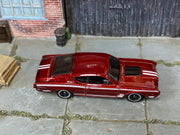 Hot Wheels '69 Mercury Cyclone metallic red and white, top view showing loose-car condition