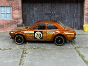 Hot Wheels '70 Ford Escort RS1600 metallic rootbeer number 70, left side view