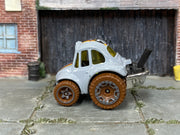 Hot Wheels ’70 Volkswagen Baja Bug gray with brown wheels — left side view