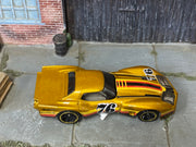Hot Wheels ’76 Greenwood Corvette gold number 76 — top view
