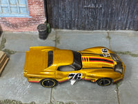 Hot Wheels ’76 Greenwood Corvette gold number 76 — top view