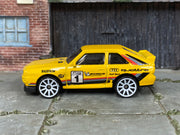 Hot Wheels '84 Audi Sport quattro yellow number 1, left side view