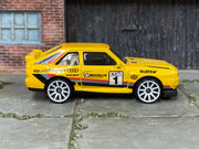 Hot Wheels '84 Audi Sport quattro yellow number 1, right side view