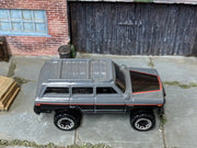 Hot Wheels '88 Jeep Wagoneer gray black and red, top view