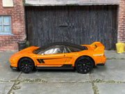 Hot Wheels ’90 Acura NSX in metallic orange — left side view