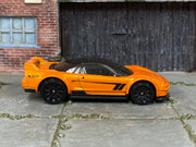 Hot Wheels ’90 Acura NSX in metallic orange — right side view