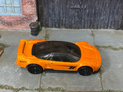 Hot Wheels ’90 Acura NSX in metallic orange — top view