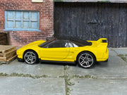 Hot Wheels ’90 Acura NSX yellow with silver wheels — left side view