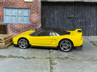Hot Wheels ’90 Acura NSX yellow with silver wheels — left side view
