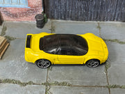 Hot Wheels ’90 Acura NSX yellow with silver wheels — top view