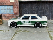 Hot Wheels ’92 BMW M3 white and green Polizei — left side view