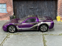 Hot Wheels '97 Corvette purple with black silver and gold graphics — left side view