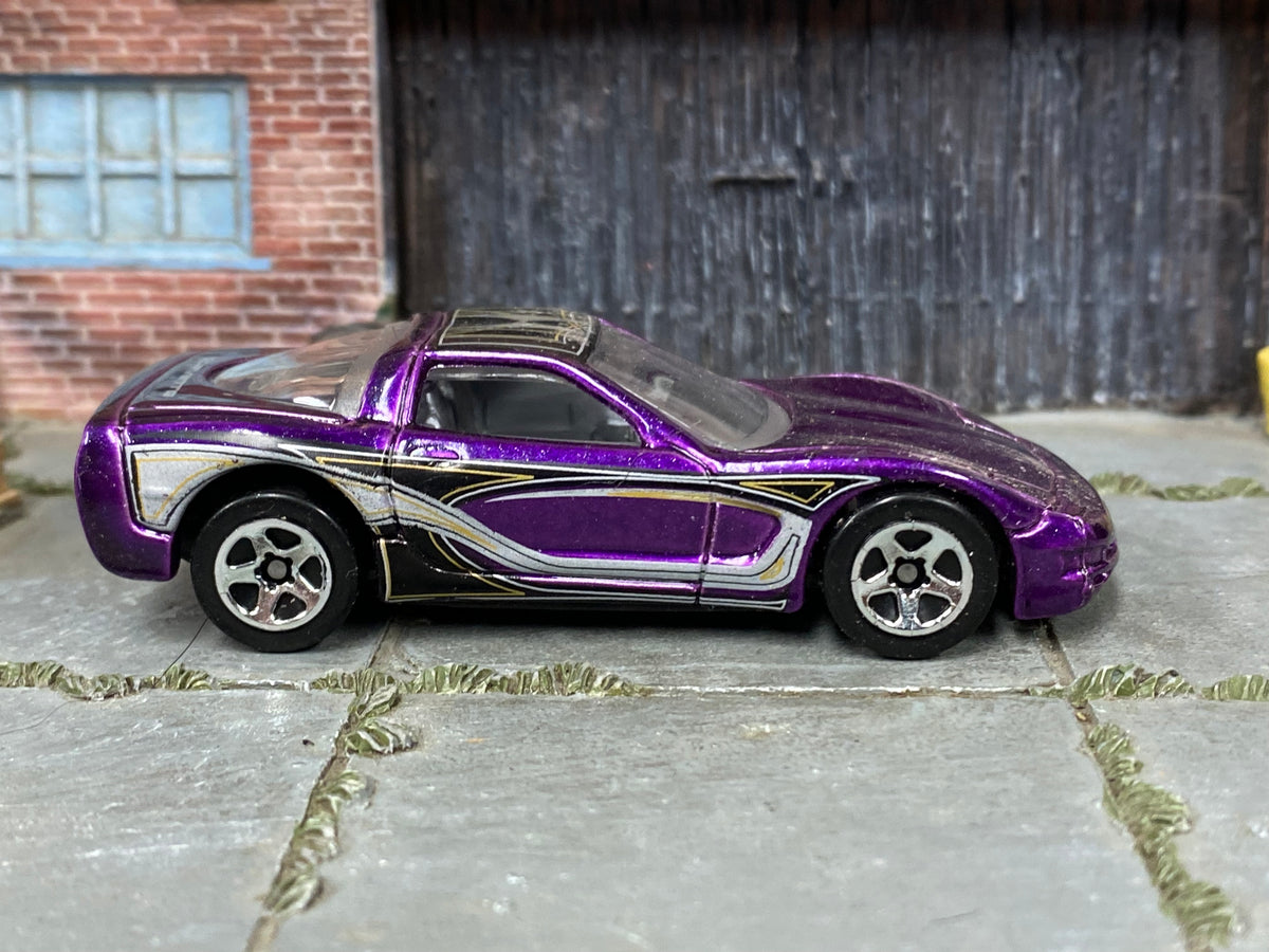 Hot Wheels '97 Corvette purple with black silver and gold graphics — right side view