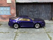 Hot Wheels '99 Mustang metallic purple with tan interior, right side view