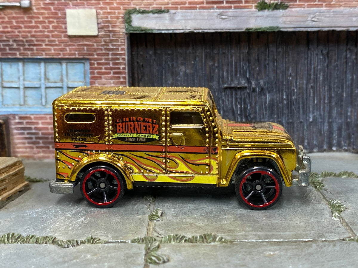 Hot Wheels Armored Truck gold Chrome Burnerz with red-rim wheels, right side view
