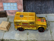 Hot Wheels Armored Truck gold Chrome Burnerz with red-rim wheels, top view