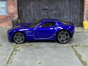 Hot Wheels Aston Martin One-77 V5651 metalflake grey loose car, left-side view