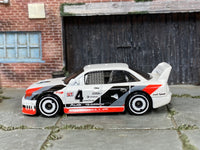 Hot Wheels Audi 90 quattro white number 4 loose car — left side view