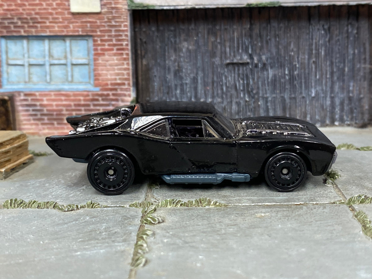 Hot Wheels Batmobile gloss black with black disc wheels — right side view