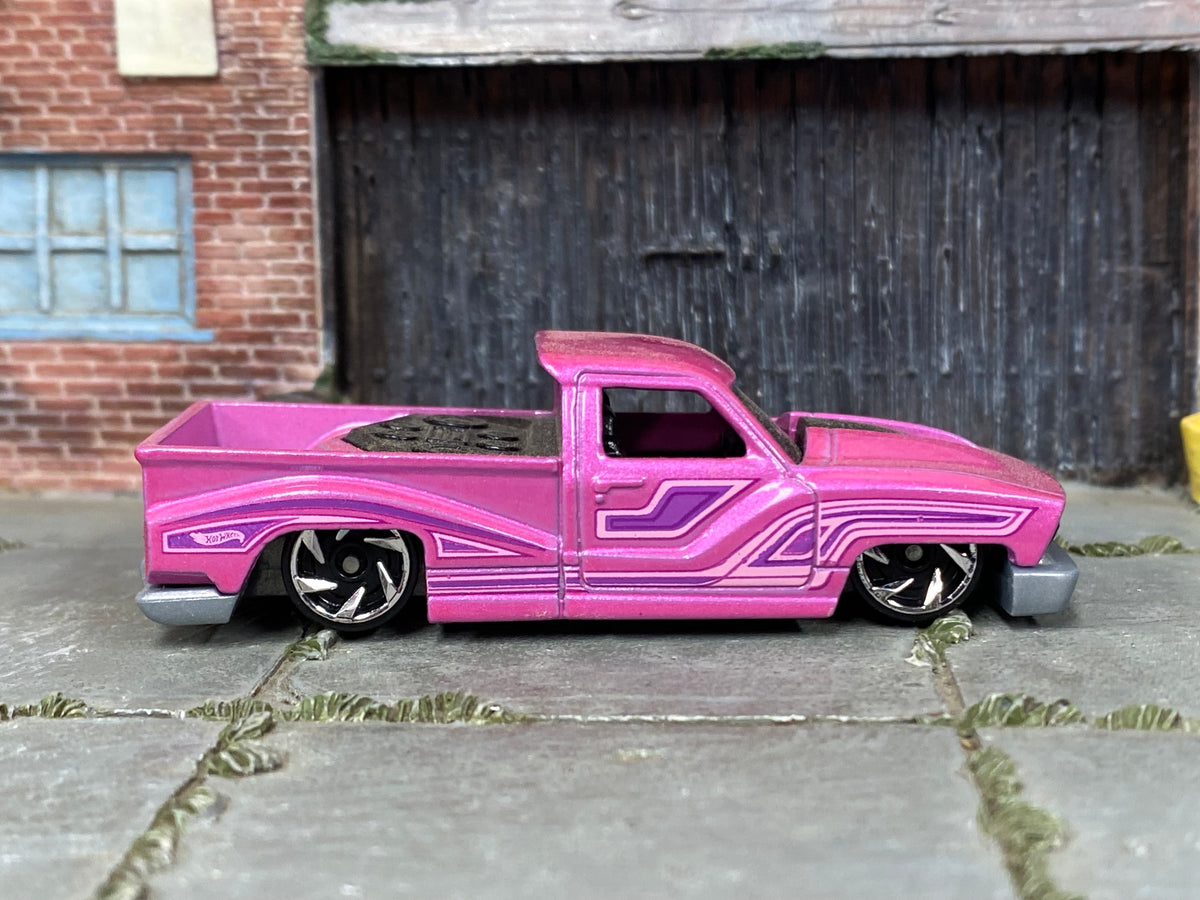 Hot Wheels Bounce'n Bass metallic pink with purple graphics, right side view