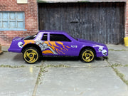 Hot Wheels Chevy Stocker purple skulls and flames loose car, right-side view