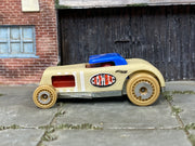Hot Wheels Chop 'n Bloc tan wood-textured body and blue roof, left side view