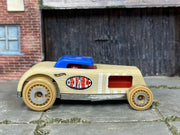 Hot Wheels Chop 'n Bloc tan wood-textured body and blue roof, right side view
